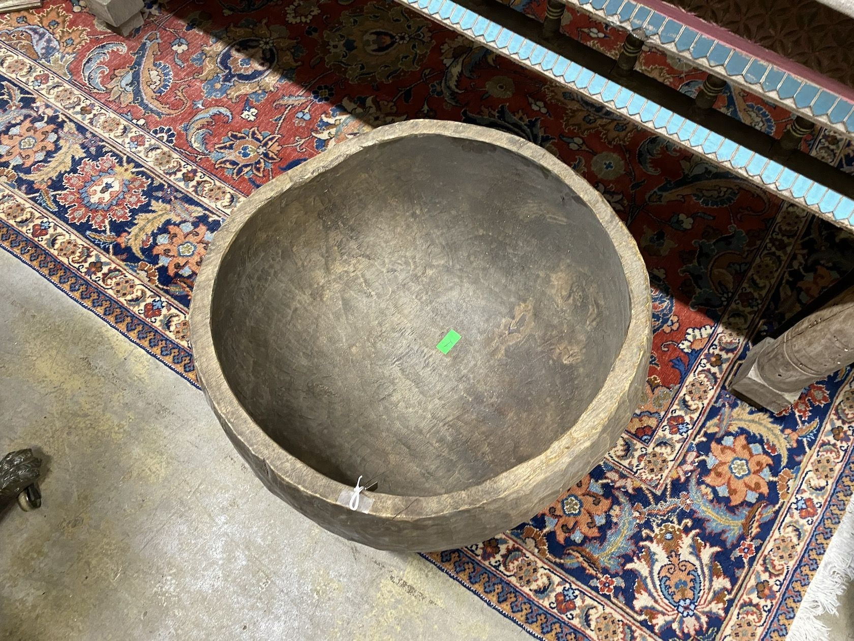 A large circular chip carved wooden bowl, diameter 64cm, height 42cm